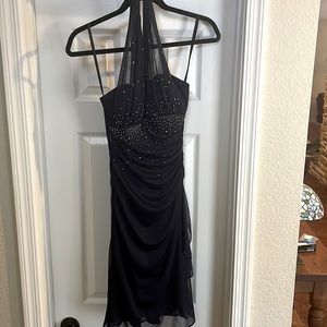 Dark blue hater dress with sequins on the body.
